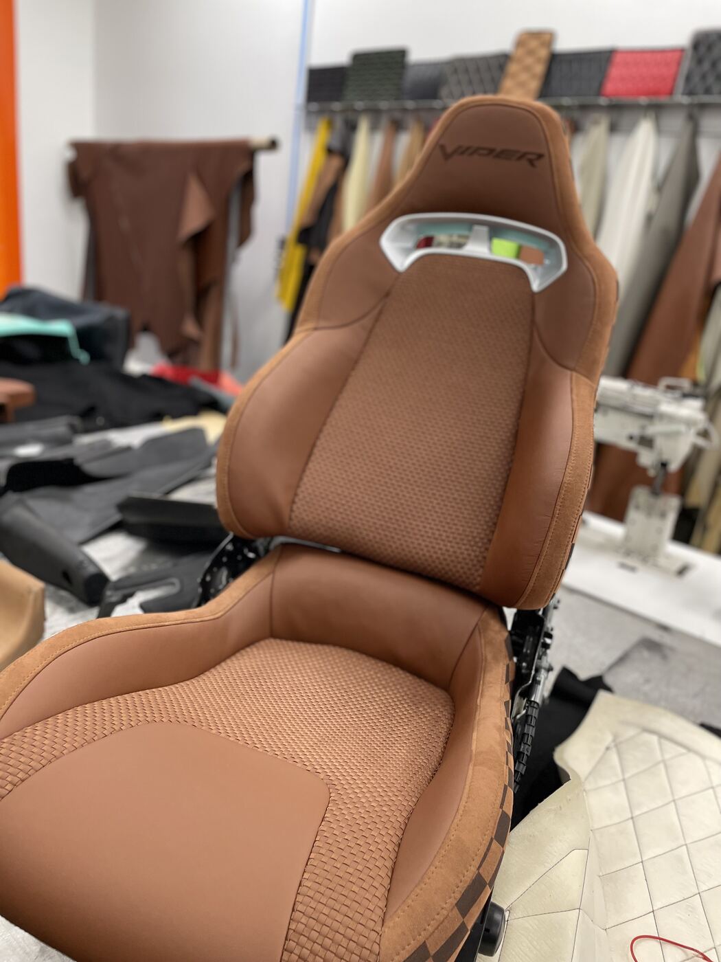 Dodge Viper bucket seat after full custom reupholstery in tan leather